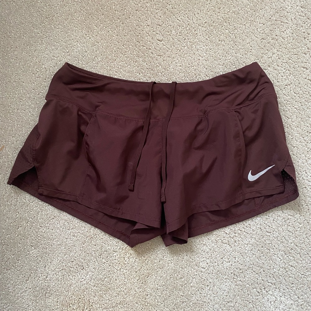 Burgundy Nike Dri-Fit shorts with built in briefs. Size M